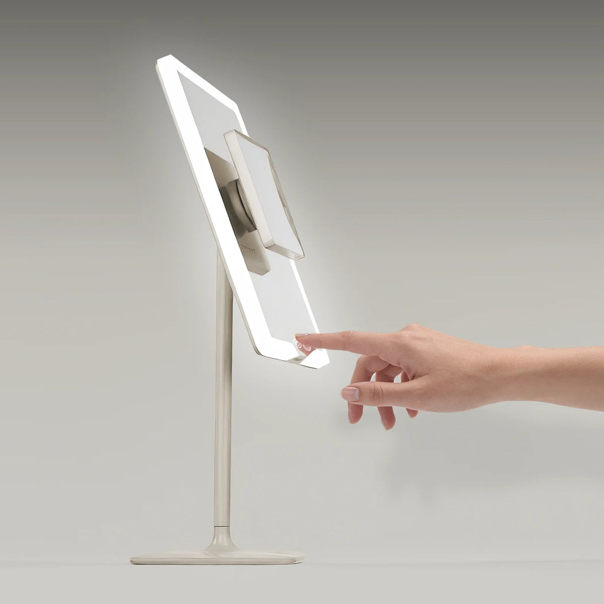 Soft Stone ORBIT cordless light up makeup mirror, a hand at the touch control