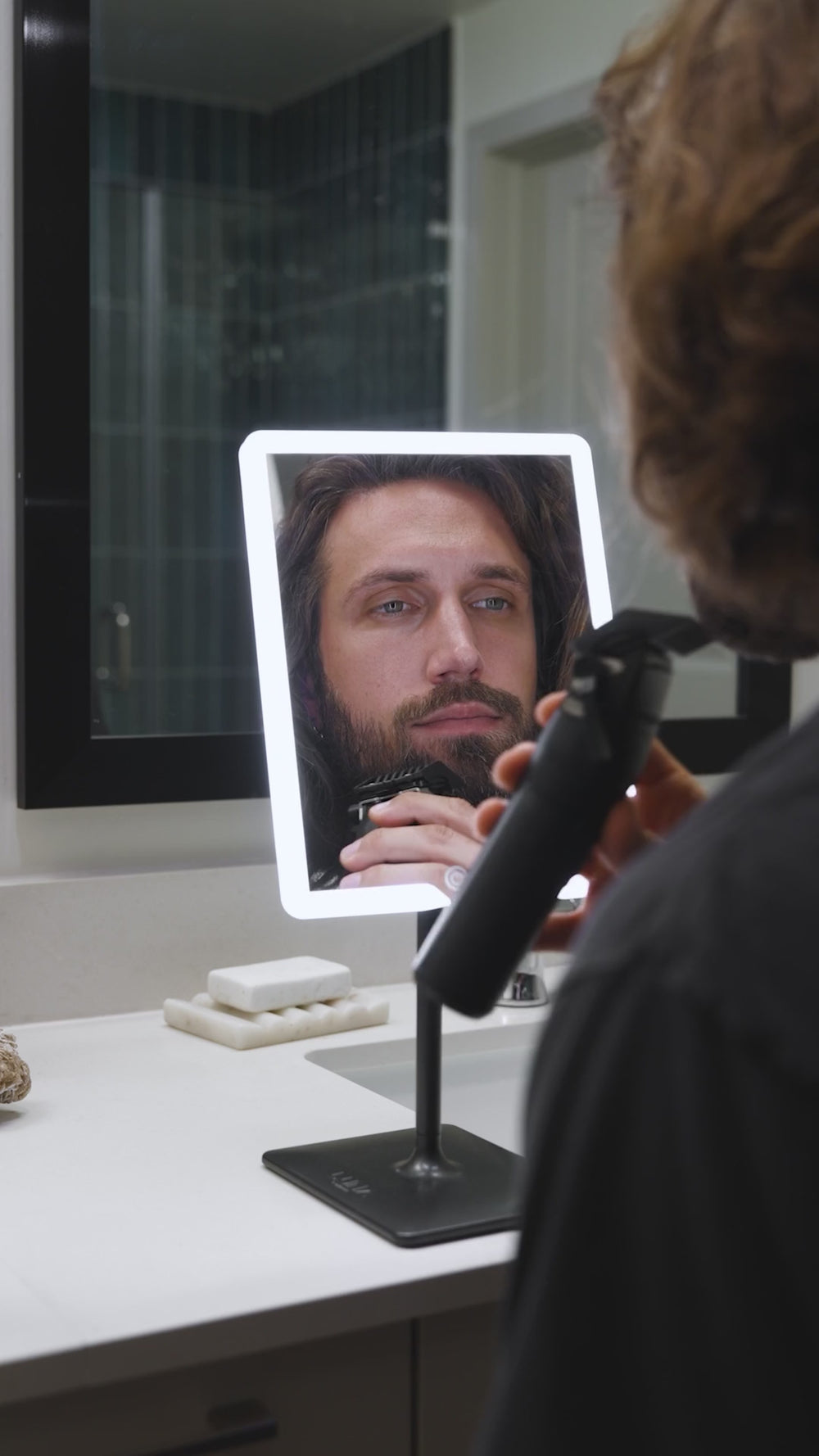 Man checking his beard in ORBIT